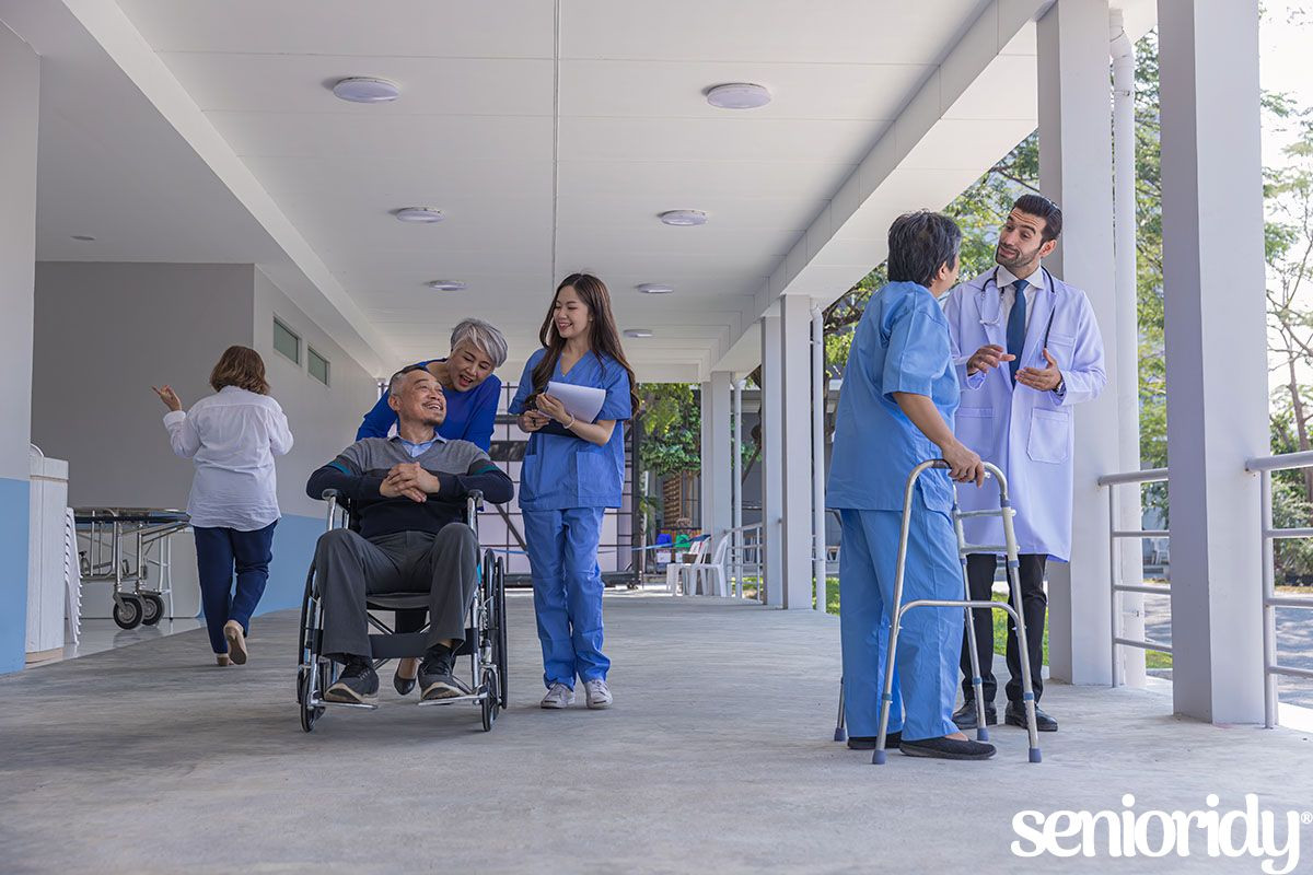 doctor-or-nurse-helping-senior-man-to-walk